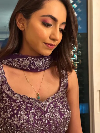 Another close-up of the eye makeup, showing the soft blending and shimmer that adds a touch of glamour.