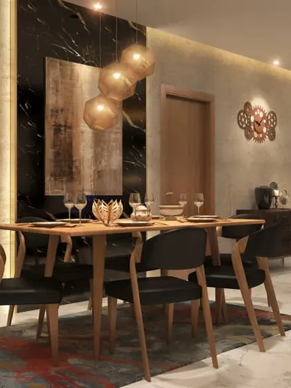 A dramatic and luxurious dining room with a black marble accent wall and gold pendant lights. The dark furniture and rich curtains create a moody and sophisticated ambiance.