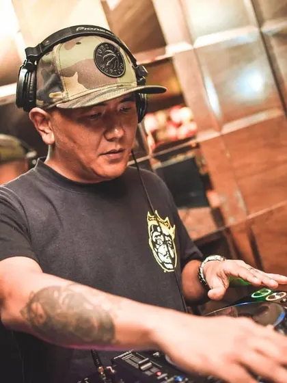 A close up shot of me working the mixer. Every track selection and transition is deliberate, all part of building the perfect party atmosphere.