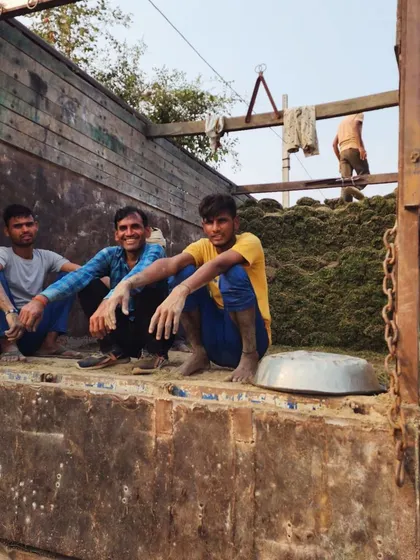 Our team, happy and hardworking, sits on a truck after a long day of loading turf. We are proud of the work we do.