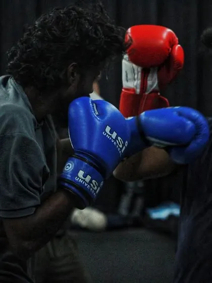 An intense exchange during sparring. The photo captures the raw energy of our training sessions.