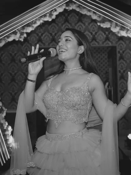 "Aao kabhi humari mehfil mein, jaam piye bagair hi jhoomne lagoge." A black and white shot that captures the essence of my promise: to create an intoxicatingly fun atmosphere with my energy alone.