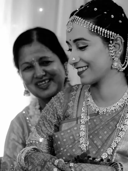 A touching black and white photo of the bride with her mother. This image beautifully captures the love and emotion shared between them on the wedding day.