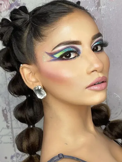 A hi-fashion makeup demo for my students. This look features bold, graphic shapes and a blend of vibrant colors, showcasing advanced techniques and creativity.