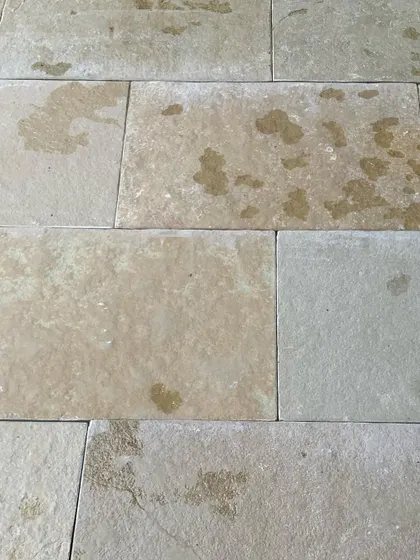 Local Tandur stone tiles, with their natural imperfections and earthy tones, are laid out on site. The choice of material is fundamental to creating an architecture that feels authentic and connected to its place.