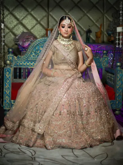 A creative shot of the bride on the swing, using dramatic lighting to create a regal and artistic portrait. This highlights my ability to play with light and shadow for effect.