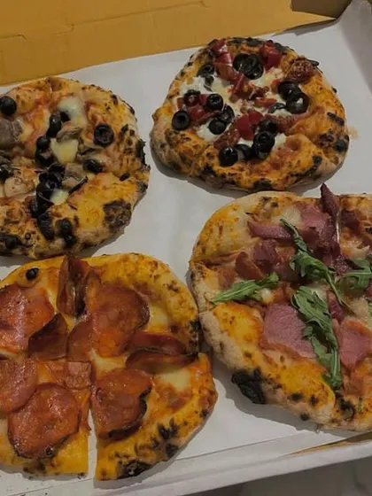 Can't decide on just one? My box of four mini pizzas is the perfect solution. This box features a variety of my most popular toppings, including pepperoni and ham.