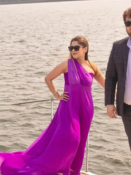 A confident and stylish pose by the couple on a yacht, perfect for a glamorous destination pre-wedding album.