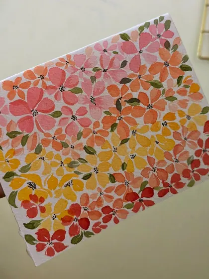 Holding up my finished floral study. It's so rewarding to see a full page of color and know you created it one flower at a time.