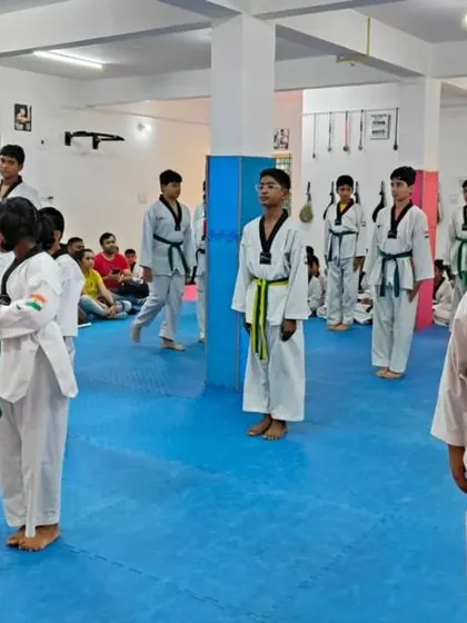 Students standing at attention during a belt exam.