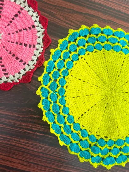 A side-by-side view of two different thalkosh designs, showcasing the variety of color combinations available.