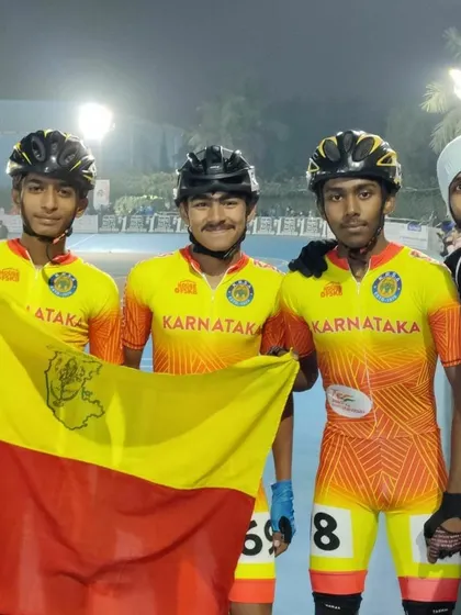 Team Karnataka celebrating together. My students proudly holding the flag after their strong performance at the national level.