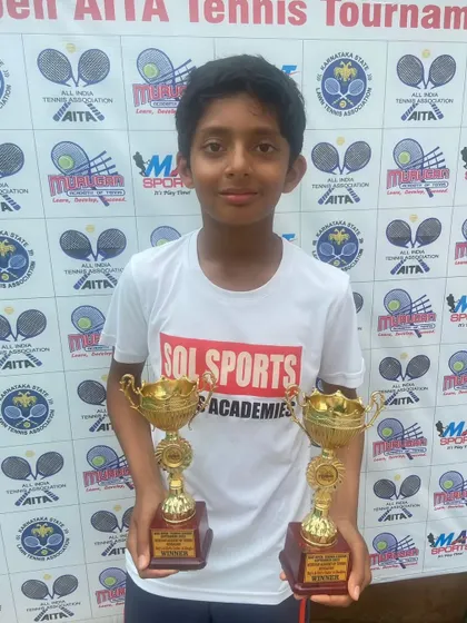Tejas Holla with his trophies from the State Open Tennis Championships. His victory in U14 singles and doubles is a testament to his hard work.