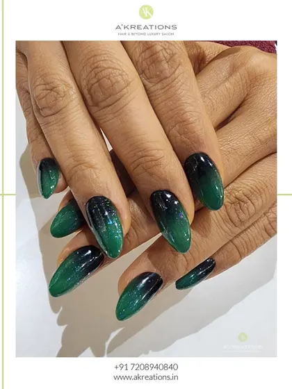 A different angle of the emerald ombre nails, showcasing the rich color depth and flawless glossy finish that makes this design so captivating.