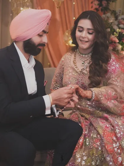 The engagement. I helped style my sister in this stunning multi-colored floral lehenga, perfectly coordinated with her fiancé's classic suit and pink pagg.