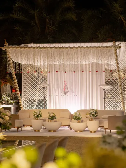 The lounge area, with its canopy of hanging mogra and red rose buds, provided a beautiful and fragrant space for guests. The traditional jaali walls reflected light, making it feel like a temple of love.
