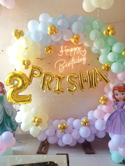A lovely princess theme for Prisha's second birthday. The pastel balloon ring is framed by cutouts of Princess Sofia and Ariel, making her dreams come true.
