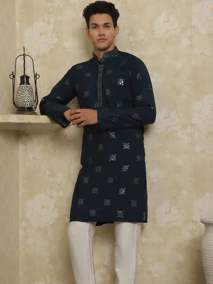 This navy blue kurta with silver booti work is a classic choice for any family function. It's lightweight, stylish, and keeps you cool.