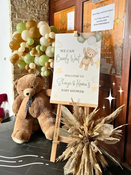 The welcome sets the tone for the whole event. For this teddy bear themed baby shower, I created an inviting entrance with a custom sign, a giant teddy, and a beautiful pampas grass arrangement.