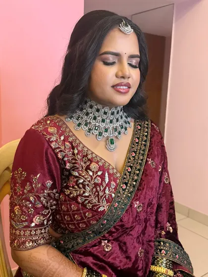 Ramya on her reception day. She wanted a makeup look with bold eyes that would last all night, and we delivered with this beautiful, glossy finish.