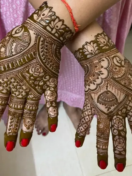 A lovely back-hand design combining peacocks, roses, and jhumkas. It's a feminine and festive pattern perfect for any celebration.