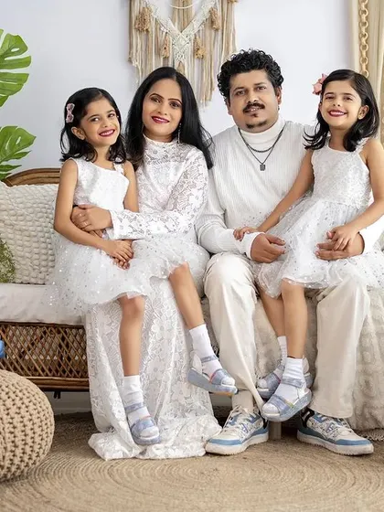 A classic family portrait with everyone dressed in white. Coordinating outfits can create a timeless and elegant look for your family photos.