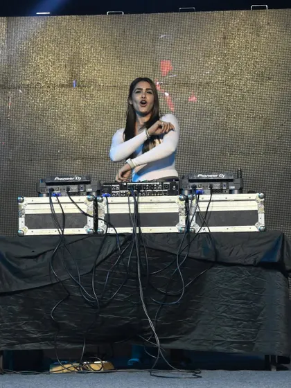A full view of my stage setup at a large outdoor festival. The professional Pioneer DJ gear and massive sound system are essential for delivering a powerful performance.