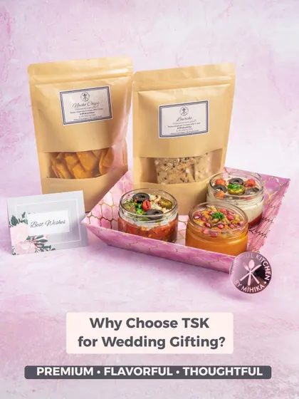 Why choose our hampers for wedding gifting? Because they are premium, flavourful, and thoughtful. This set shows a simple yet elegant arrangement with dips, crackers, and a 'Best Wishes' card.