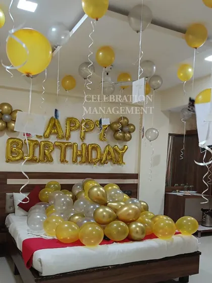 The combination of yellow, gold, and silver balloons creates a bright and festive atmosphere, perfect for waking up to on your birthday.