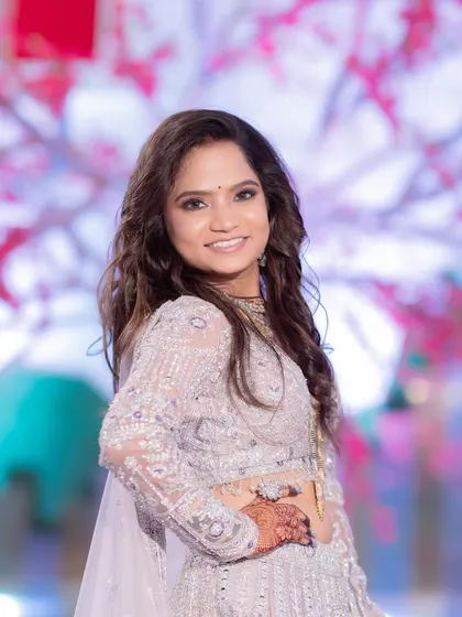 A happy and radiant bride. The makeup is glamorous yet feels light, allowing her to enjoy her reception to the fullest.
