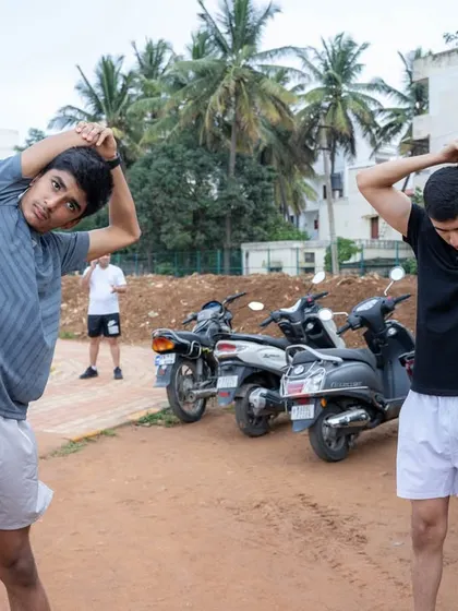 Two younger participants stretch before the trial run, showing that fitness is for all ages.