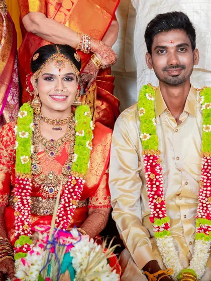 These photos capture the beautiful moments of a traditional wedding. The bride's red silk saree is draped to stay perfect through all the ceremonies, from sitting at the mandap to seeking blessings.