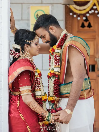 An intimate and emotional portrait of Akash and Snigdha on their wedding day, captured in a quiet moment at the temple.