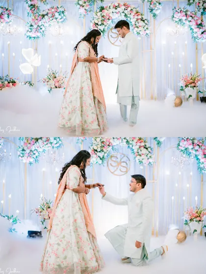 The ring exchange moment during a dreamy engagement ceremony with a floral arch and ethereal smoke effects.