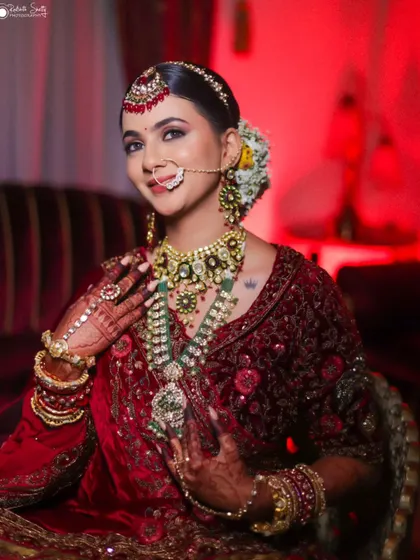 A duplicate of a stunning bridal portrait, this image continues to showcase the bride's joy and the intricate details of her wedding day look.