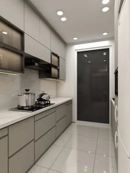 This parallel kitchen layout is designed for efficiency. It features handleless drawers, fluted glass upper cabinets, and a chimney, all arranged for a smooth cooking workflow.
