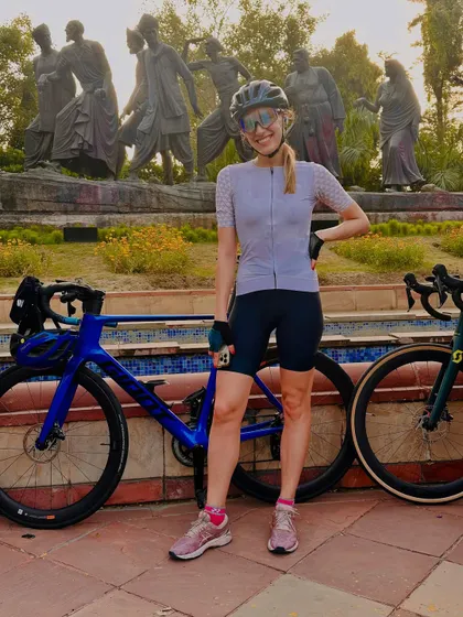 Posing with her Cervelo bike in front of the Gyarah Murti sculpture.