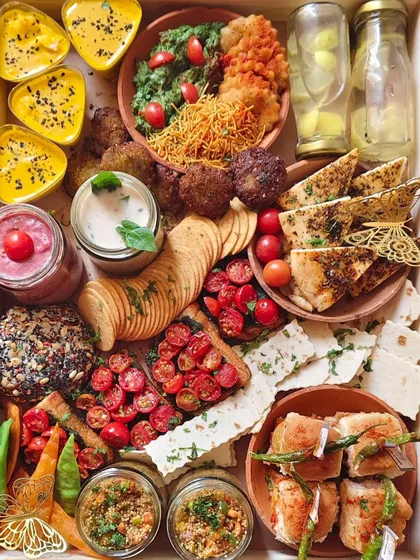 This is what I call a feast for the eyes and the soul. My signature grazing platters are packed with a world of flavours, including modern twists on classics like Vada Pav, fresh pesto bruschetta, creamy hummus, and savoury falafel. It’s an entire party in one box, perfect for sharing.