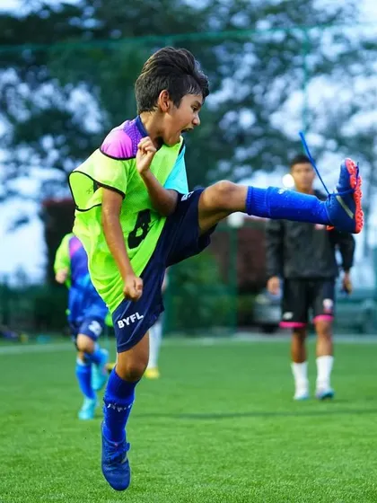 A player shows great technique and power as he strikes the ball during a training session.