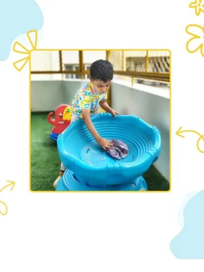 Taking ownership of our shared space is a key part of our day. This child is carefully cleaning the outdoor play equipment, learning the importance of contributing to the community and taking pride in his environment.