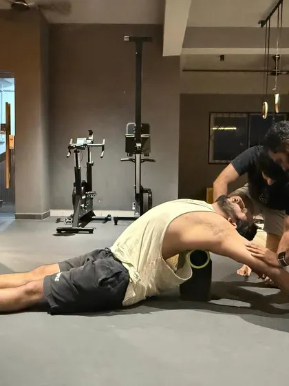 Working on my thoracic extension with a foam roller and some help from a partner. Assisted stretching can help you get into deeper ranges of motion that are hard to reach on your own.