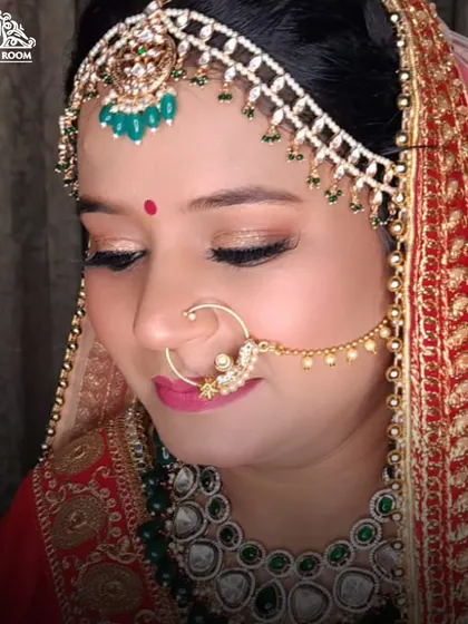 A beautiful close-up of bridal eye makeup. The soft gold shimmer on the lid catches the light, and the liner is sharp and precise.