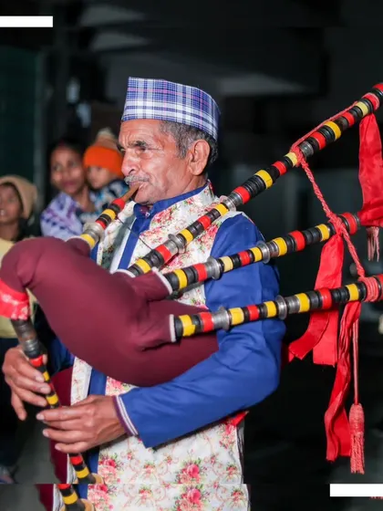 A portrait of a traditional bagpiper at a wedding, adding a unique cultural element to the baraat procession.