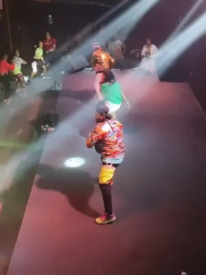 On stage with a fellow instructor during the 'Let Loose' show. Our coordinated energy and passion for dance create a powerful performance.