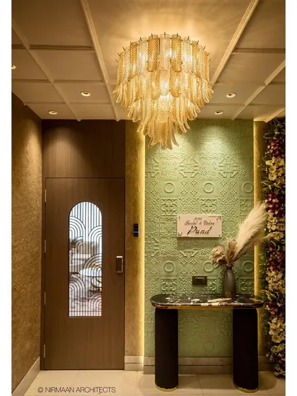 First impressions matter. For this duplex foyer, we designed a grand entrance that sets a tone of modern elegance, using a statement chandelier, textured walls, and a sleek console to welcome you home.
