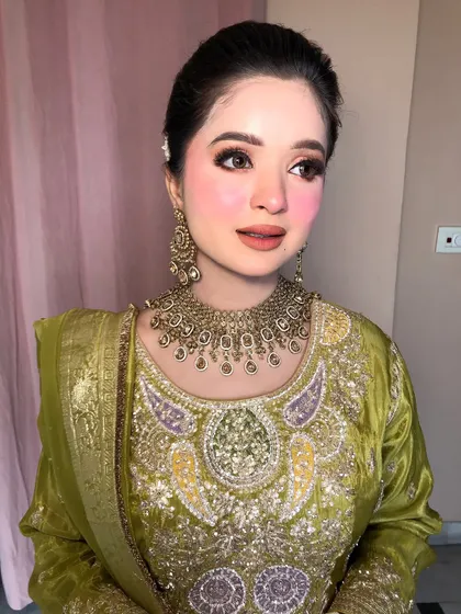 A close-up of the makeup, showing the seamless blend of blush and highlighter.