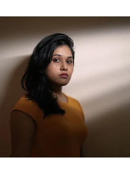 Using dramatic window light to create shadows and mood. This is a simple but powerful portrait that focuses on form and emotion.