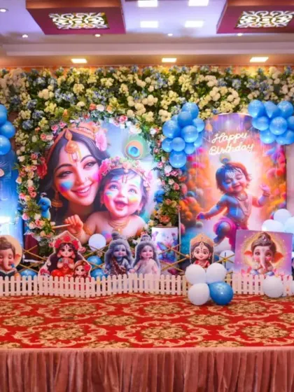 A clear, bright shot of the Krishna-themed birthday stage.