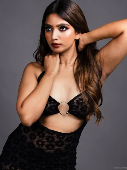 A three-quarter portrait with a dynamic pose, showing the model's form.