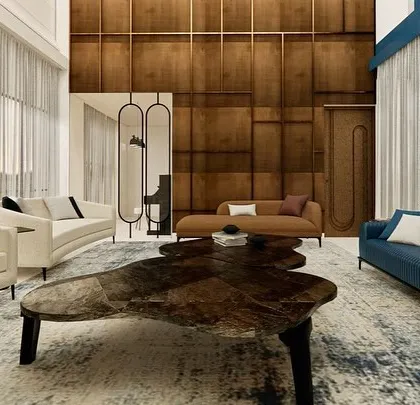 This render showcases a modern luxury duplex with high ceilings and a playful use of color. The design features a mix of curved white sofas and a striking blue fluted sofa, all anchored by a unique, organically shaped center table, creating a space that is both grand and inviting.